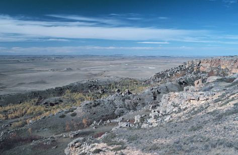 The southwest edge of Black Butte, Slope County. Note that numerous sandstone blocks litter this slope. These blocks broke from the caprock and toppled and slid down the slope. Snow Cave was located in this general area. 